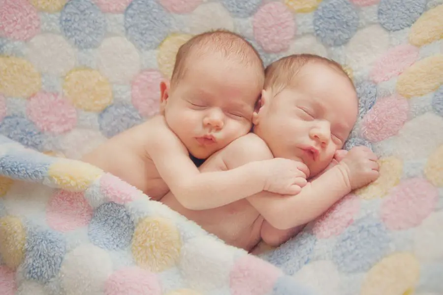 twins babies rescuing hug